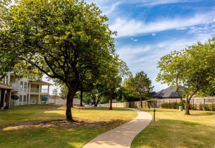 Peaceful Walking Paths Through Community Grounds at Independent Living Facility Peaceful Walking Paths Through Community Grounds at Independent Living Facility