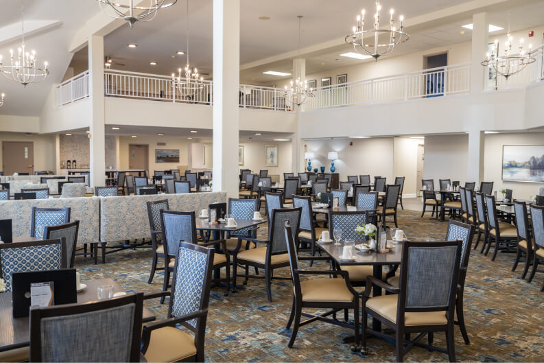 Spacious Dining Room With Multiple Seating Areas for Resident Meals at Independent Living Facility Spacious Dining Room With Multiple Seating Areas for Resident Meals at Independent Living Facility