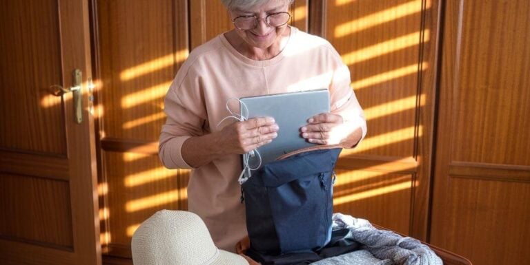 Elderly Woman Packing Bag for Trip at Independent Living Facility