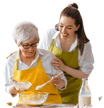 Elderly Woman Mixing Batter While Baking in Kitchen at Independent Living Facility Elderly Woman Mixing Batter While Baking in Kitchen at Independent Living Facility