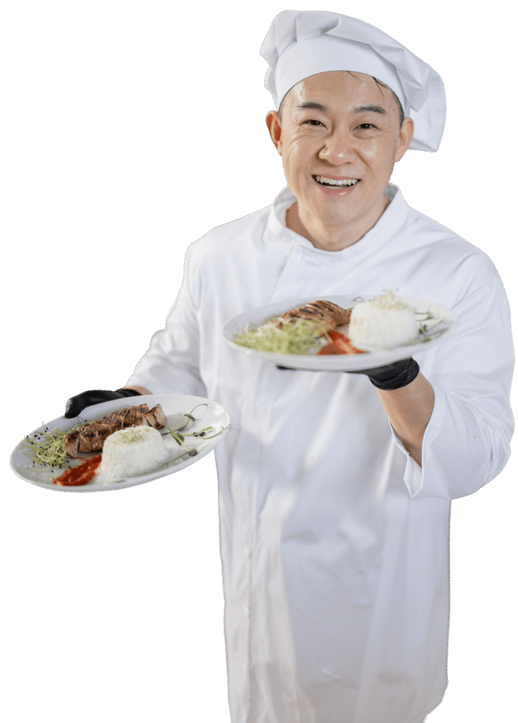 Smiling Chef Presenting Two Freshly Plated Meals at Independent Living Community Smiling Chef Presenting Two Freshly Plated Meals at Independent Living Community