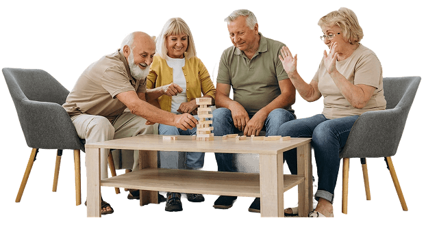 Elderly Friends Playing Wooden Block Stacking Game Together at Independent Living Community Elderly Friends Playing Wooden Block Stacking Game Together at Independent Living Community