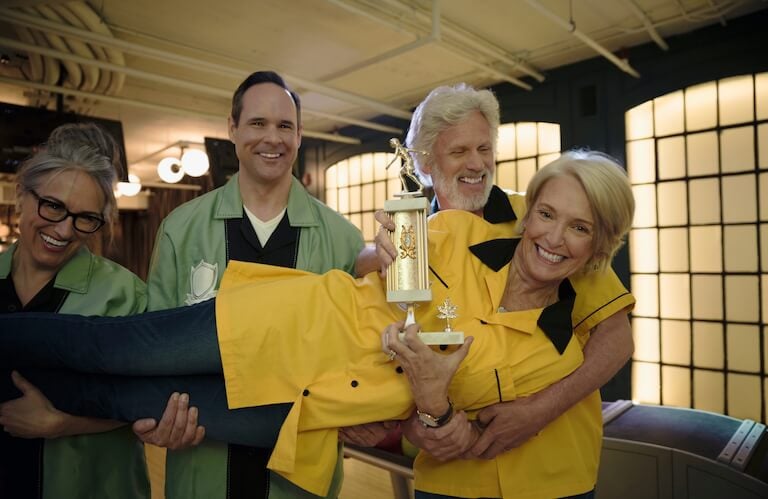 Elderly Bowling Team Celebrating Their Victory with a Trophy at Independent Living Facility