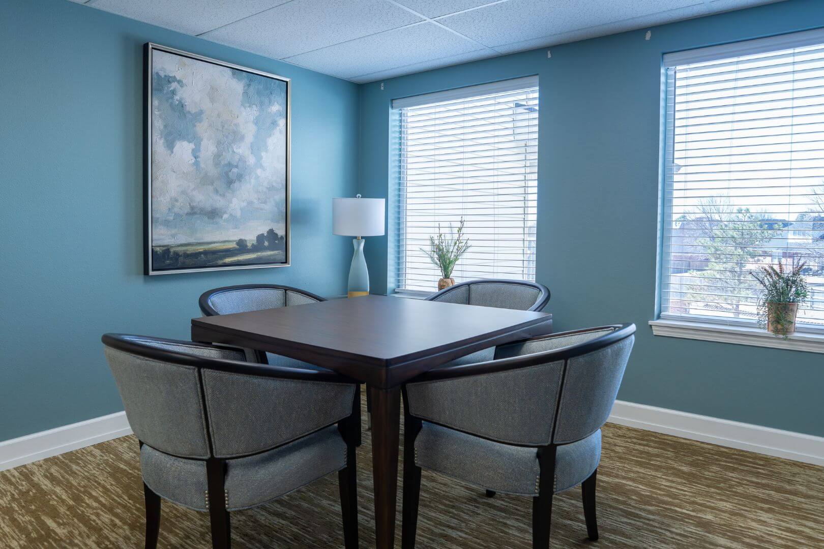 Quiet Corner Game Room with Square Table and Armchairs in Our Independent Living Facility