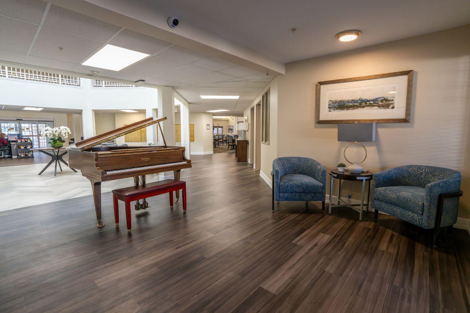 Open Common Area with Grand Piano and Cozy Seating in Independent Living